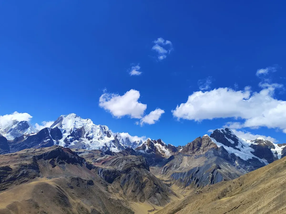 Snow-capped ridges and cumulus clouds over the Andes